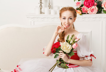 Pretty ballerina holding flowers