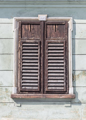 window with closed shutters