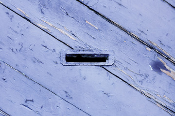 Ancient letterbox opened on wooden door in Tbilisi, Georgia