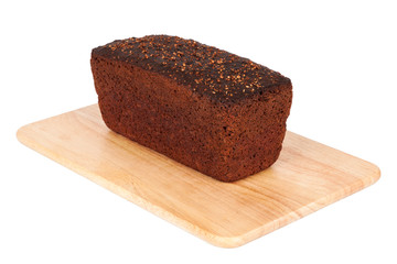 Borodinsky bread closeup. Traditional Russian rye-wheat bread with molasses, malt and coriander on wooden cutting board isolated on white background