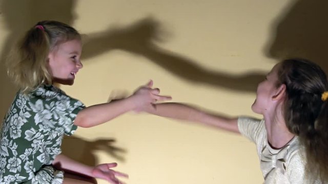 Mimic game: shadows of people's arms render an impulsive chat.