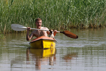 canoe boy and dog
