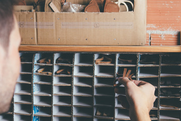 Craftsman putting in boxes glasses rim