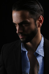 Beautiful bearded man on a black background
