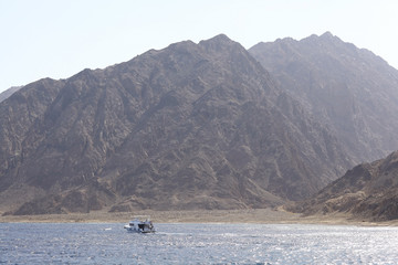 Mountains pond boat sky