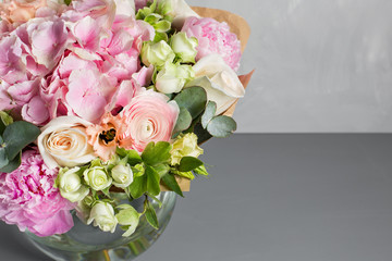 Still life with a bouquet of flowers. the florist put together a beautiful bunch of flowers. Man manual work used different types of flowers and colors. copy space