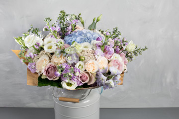 Still life with a bouquet of flowers. the florist put together a beautiful bunch of flowers. Man manual work used different types of flowers and colors. copy space