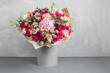 Still life with a bouquet of flowers. the florist put together a beautiful bunch of flowers. Man manual work used different types of flowers and colors. copy space