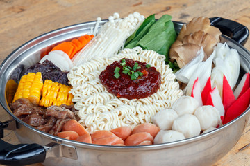 Set of Sukiyaki, Shabu with noodle and vegetable in the pot on wooden table