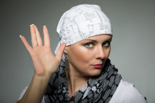 beautiful middle age woman cancer patient wearing headscarf