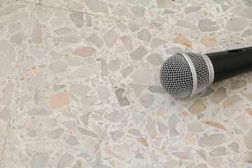 Microphone dynamic on floor marble polished stone background