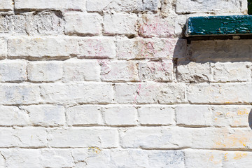 white brick wall with paint, grunge, shadow