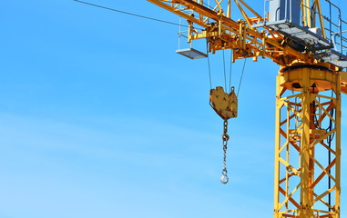 Metallic hook of a crane during the construction phase of a building.