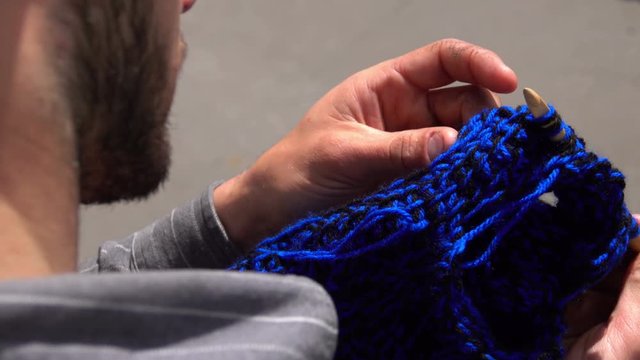 Young Man Knitting