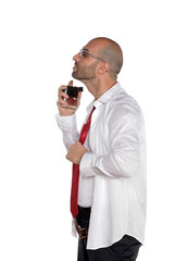 Young man puts perfume on a white background
