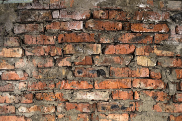 Aged broken brick wall background  texture.Broken bricks close up.