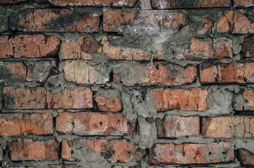 Aged brick wall background  texture.Broken bricks dark background.