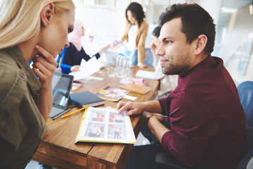 Two colleagues making a comparison