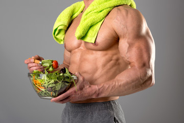 Healthy man eating a salad
