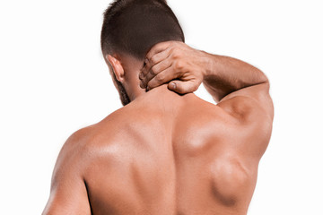 Studio shot of man with pain in neck