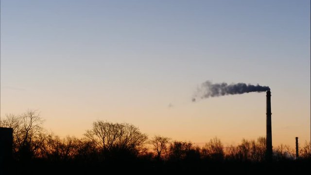 Sunrise Time Lapse Sky and moving clouds Power Plant pipe with smoke Latvia 4K