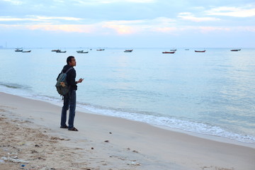 Man stand at Payoon Beach in Rayong ,Thailand