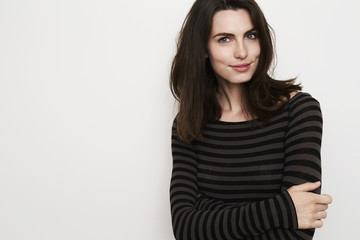 Beautiful brunette woman in stripes, portrait