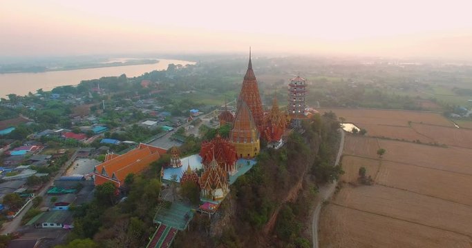Tiger cave temple in Kanchanaburi.

a golden Buddha,temple,pagodas and  Thai architecture building on hilltop. the most beautiful top ten of temples in Thailand 