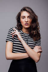 Obraz premium Fashion portrait pretty sweet young woman over grey background