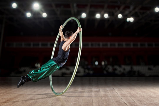 Circus artist in a Cyr Wheel