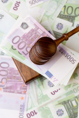 Photography of hammer with money