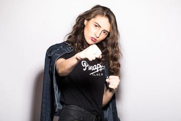 Style cool hipster Girl giving punch over isolated white background