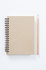 Notebook with pencil on white background