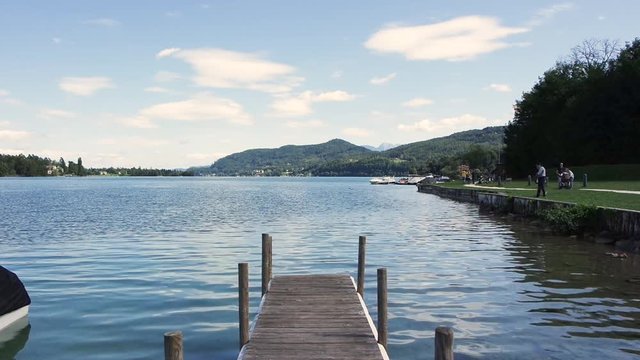 People walking and relaxing at Woerthersee Lake, Carinthia. 