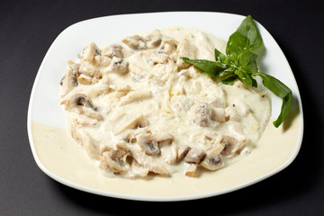 Chicken fillet with mushrooms in creamy sauce. Italian style. Italian food. Italian cuisine.