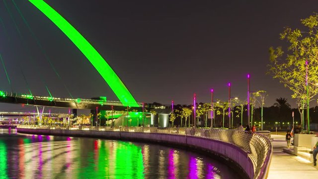 dubai water canal night light crossing bridge downtown panorama 4k time lapse uae
