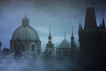 Fototapeta premium Mysterious evening in Prague. Mystic fog over the Charles Bridge