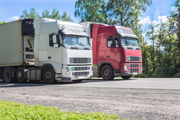 Fototapeta na wymiar trucks transporting freight