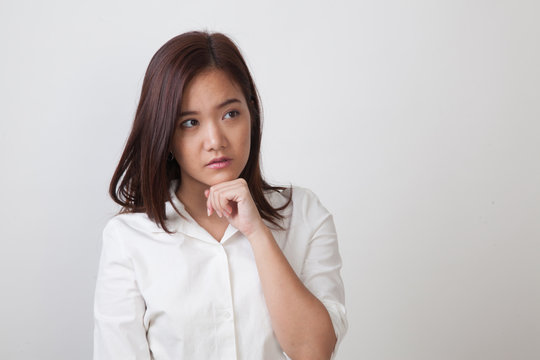 Serious  young Asian woman  look away.