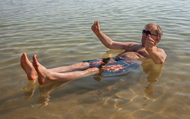 Man relaxing in water.