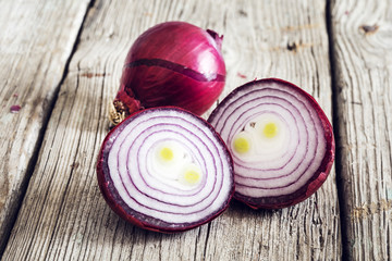 Onions on wooden background