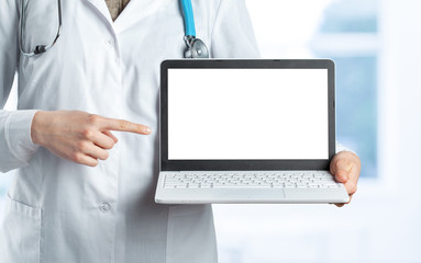 Hands of medical doctor woman with laptop