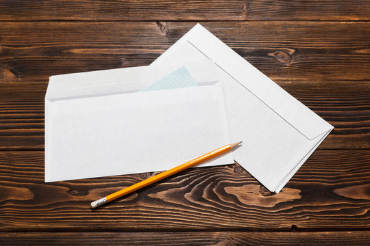 Envelopes On Wooden Table