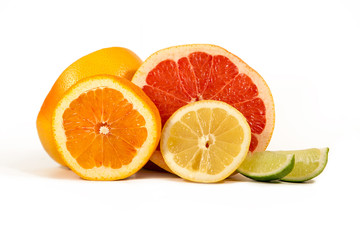 Isolated Citrus Fruits. Slices of Lemon, Orange, Lime and Grapefruit. Isolated on White Background With Clipping Path.