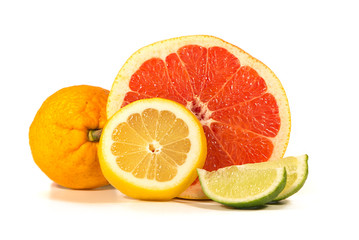 Isolated Citrus Fruits. Slices of Lemon, Orange, Lime and Grapefruit. Isolated on White Background With Clipping Path.