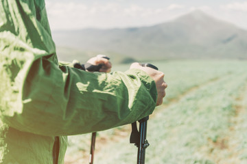 Hiker holding trekking poles