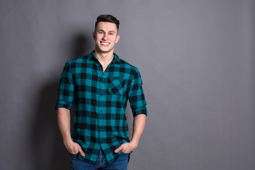 Obraz premium Young handsome man studio portrait, boy style