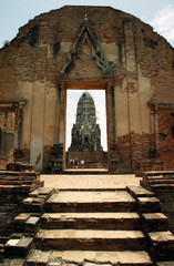 Tourists in Ancient ruins of Hindu temple in Ayutthaya in Thailand