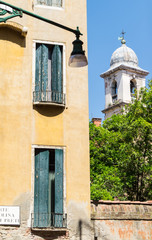 Glimpse of venice with bell tower. vertical