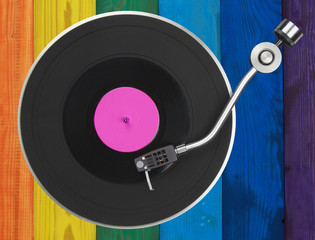 Abstract  turntable over  colorful wooden planks